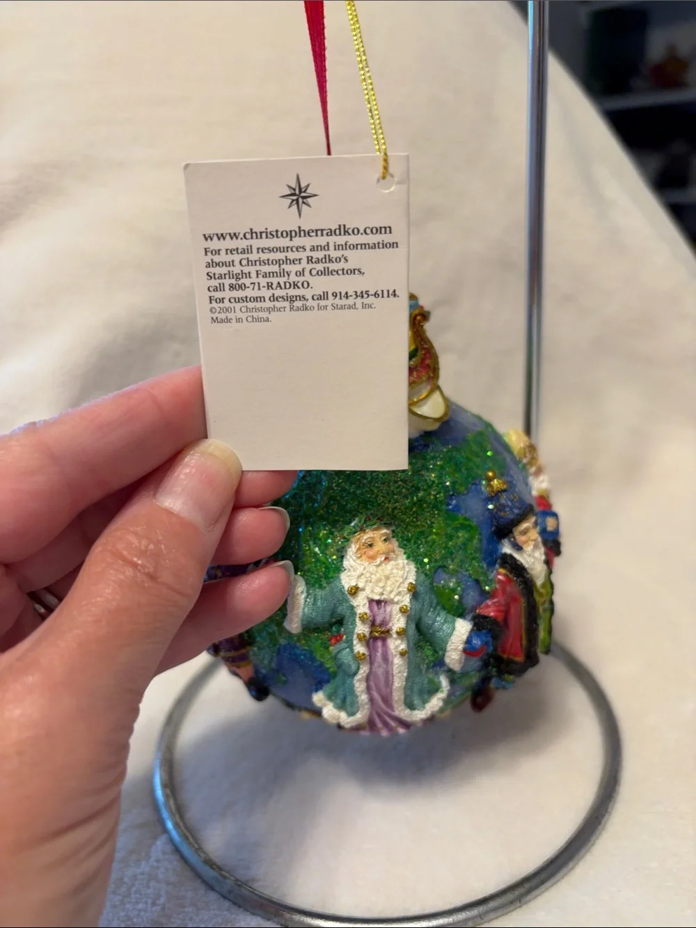 Christopher Radko Santa’s around the world with tag